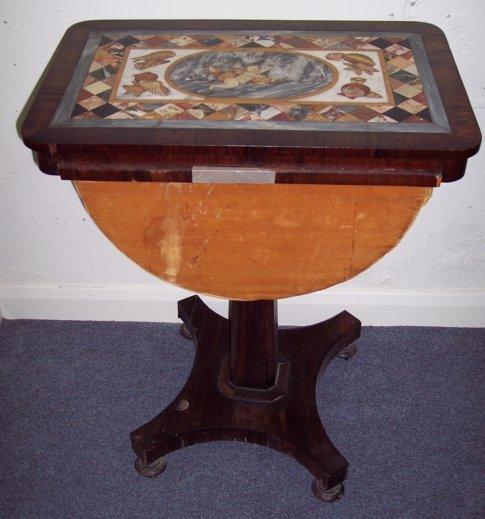 Appraisal: A Regency rosewood work table with specimen marble top inlaid