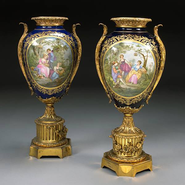 Appraisal: A pair of Sevres style porcelain gilt bronze mounted urns