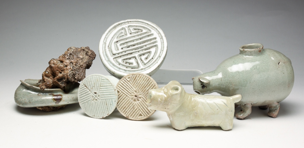 Appraisal: GROUP OF KOREAN POTTERY FIGURES AND STAMPS Possibly Joseon dynasty