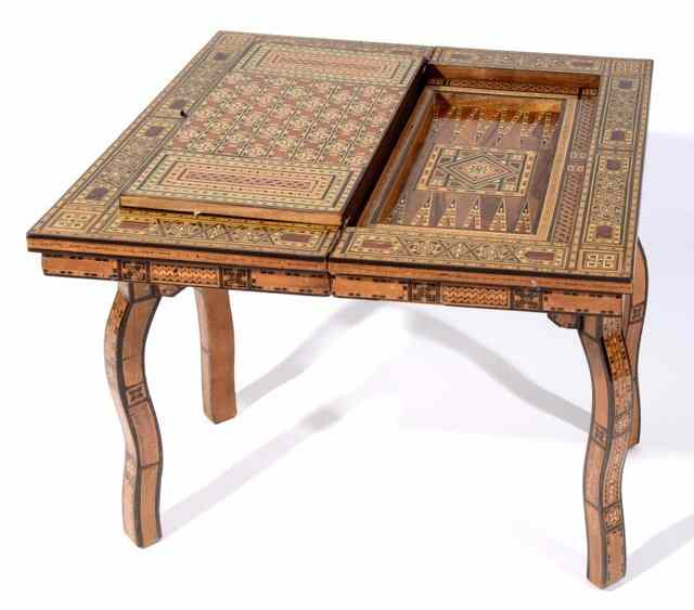 Appraisal: A DAMASCUS GEOMETRIC INLAID FOLDING GAMES TABLE with rectangular top