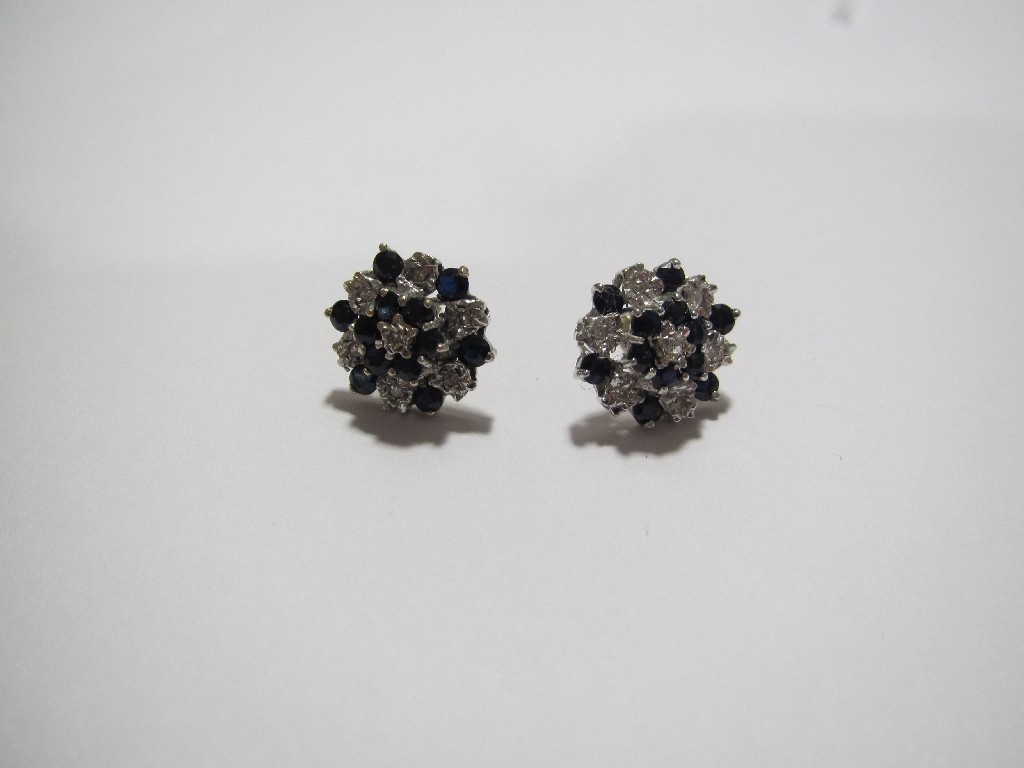 Appraisal: Pair of sapphire and diamond flowerhead cluster earrings in yellow