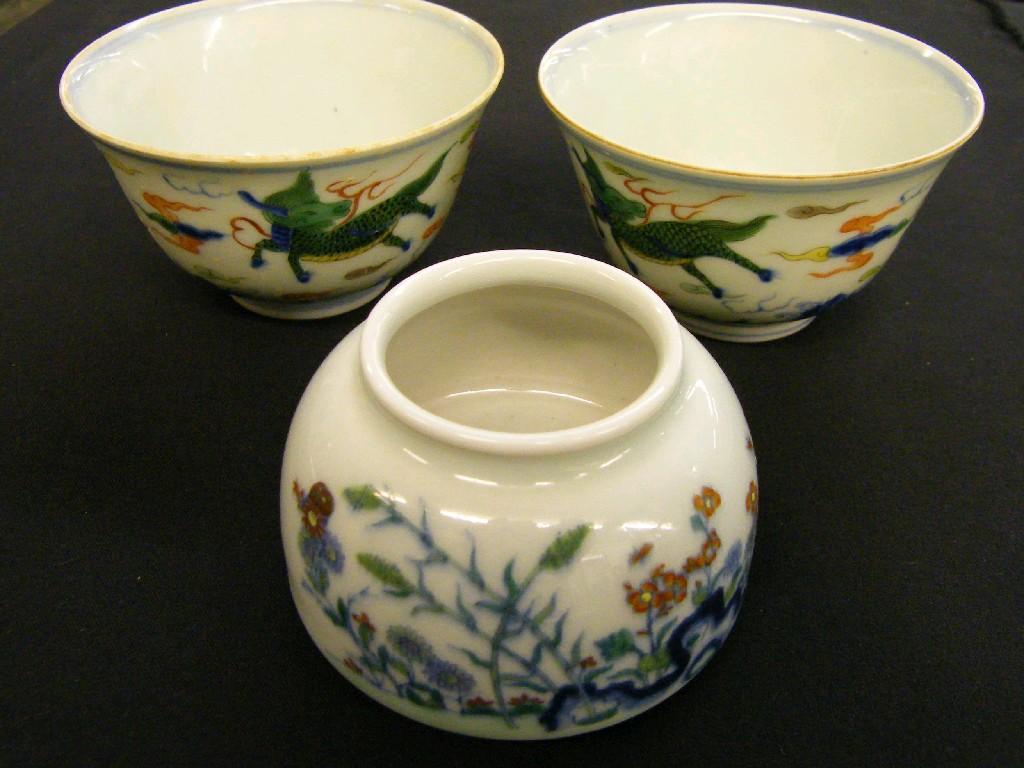 Appraisal: Pair of Chinese porcelain polychrome tea bowls decorated with a