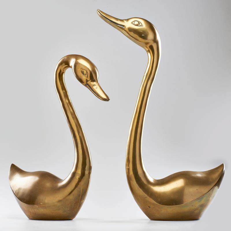 Appraisal: DESIGNER Two brass swan sculptures s Unmarked Taller x x