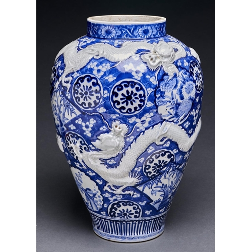 Appraisal: A Japanese blue and white Imari vase moulded in shallow