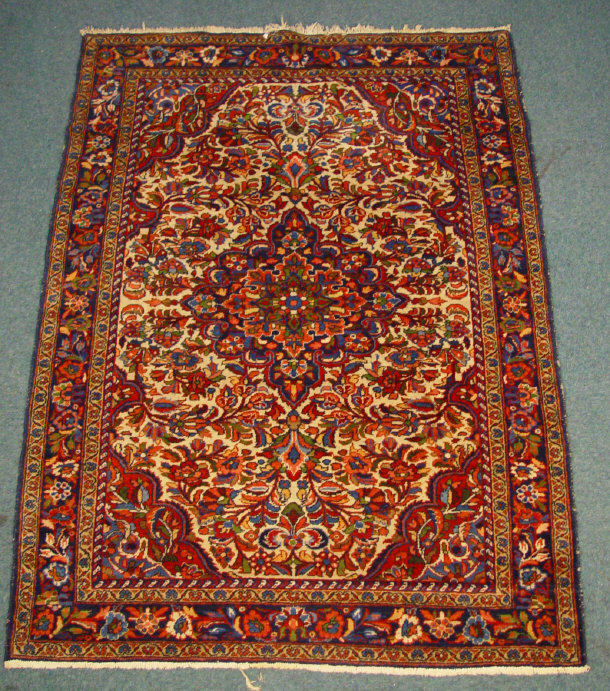 Appraisal: Rectangular blue ground rug decorated with a colourful floral pattern