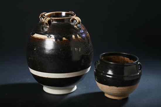 Appraisal: TWO CHINESE BROWN GLAZED STONEWARE VESSELS Each ovoid-form with loop-shaped