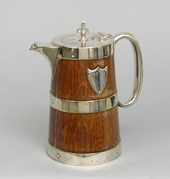 Appraisal: A Handsome Oak Tankard Pitcher with Silver Plated Mounts The