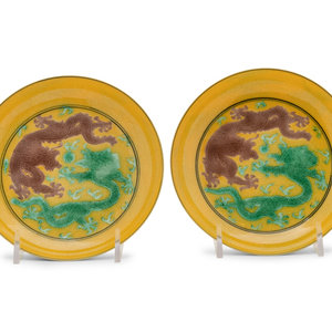 Appraisal: A Pair of Yellow Ground Porcelain 'Dragon' Dishes each with