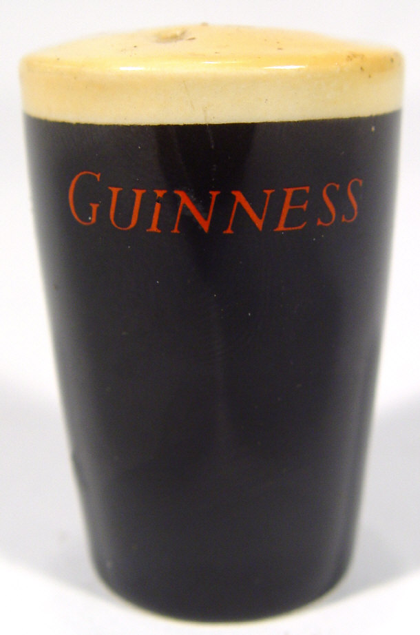 Appraisal: Guinness advertising china pepperpot in the form of a pint