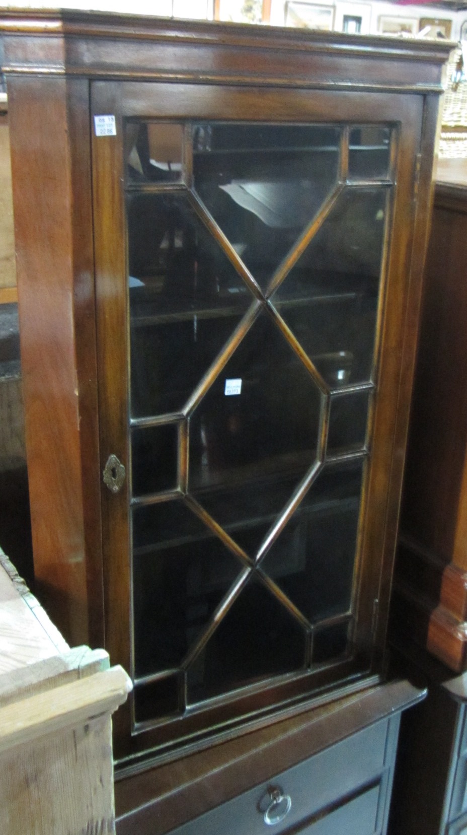 Appraisal: A th century mahogany glazed corner cabinet and a walnut