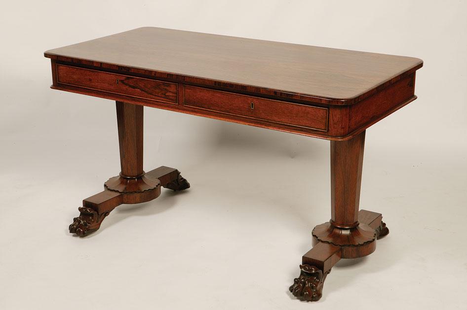 Appraisal: A REGENCY ROSEWOOD LIBRARY TABLE the rectangular top with moulded