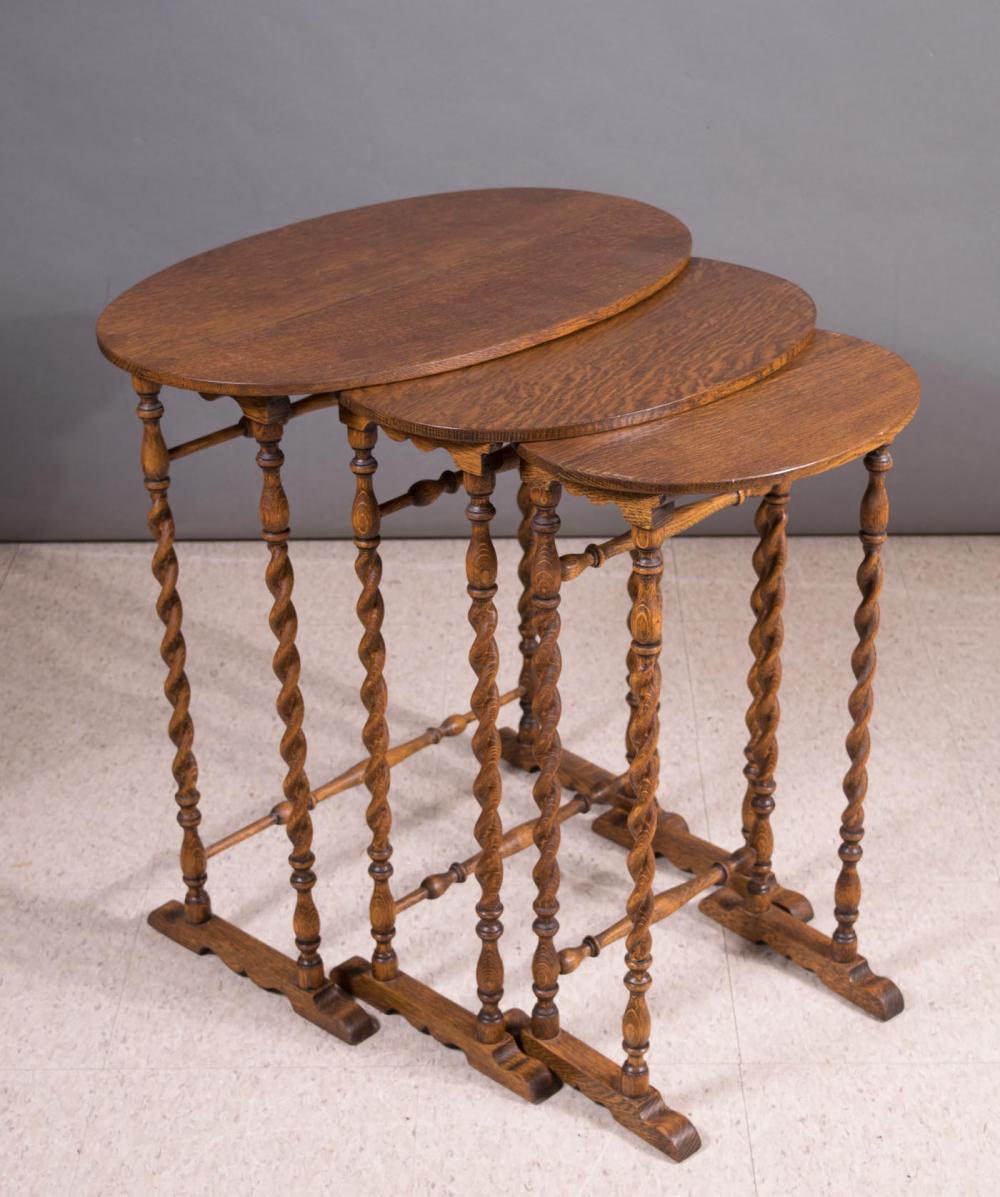 Appraisal: THREE-PIECE OAK NESTING TABLE SET American early th century graduated