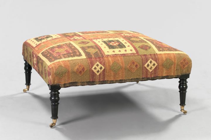 Appraisal: Large Sheraton-Style Upholstered Square Ottoman the turned legs ending in