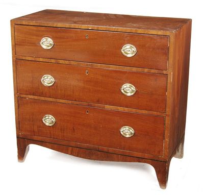 Appraisal: A small mahogany chest with three long graduated drawers fitted