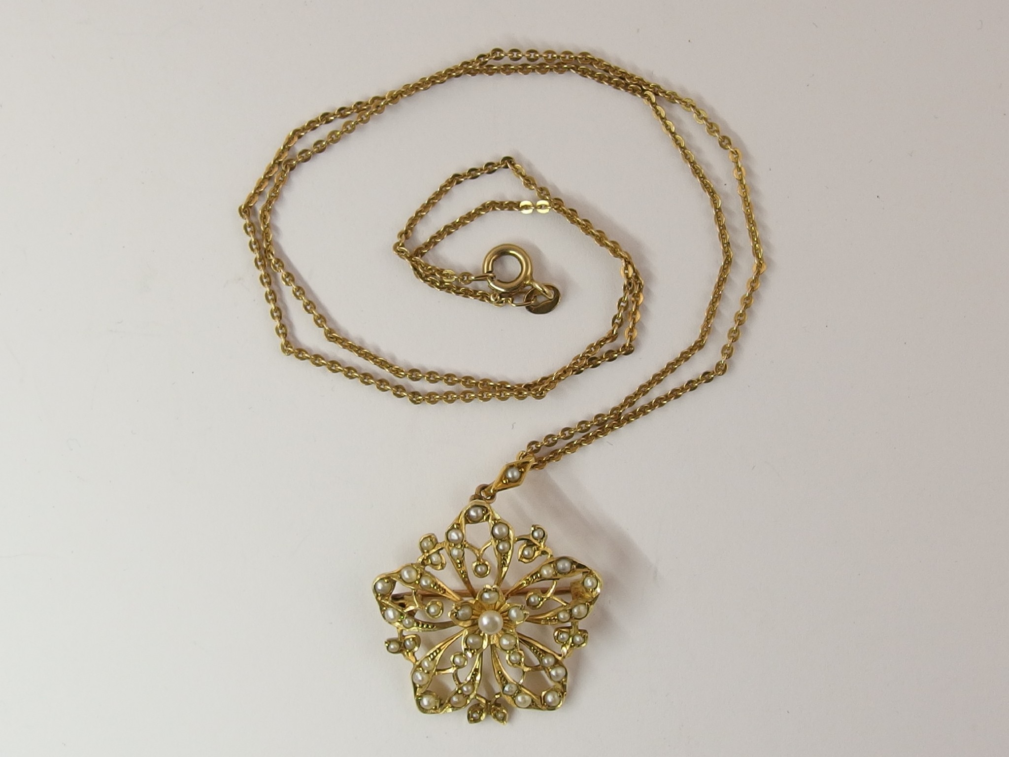 Appraisal: An Edwardian flower pendant set with seed pearls with a