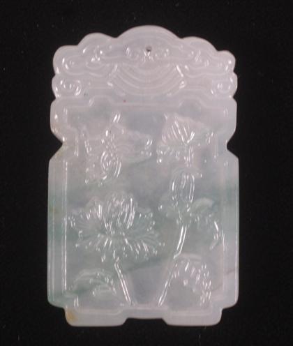 Appraisal: Chinese mottled green jadeite pendantRectangular outline carved to show peony