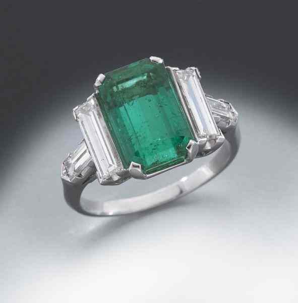 Appraisal: Retro platinum Columbian emerald and diamond ringfeaturing an emerald cut