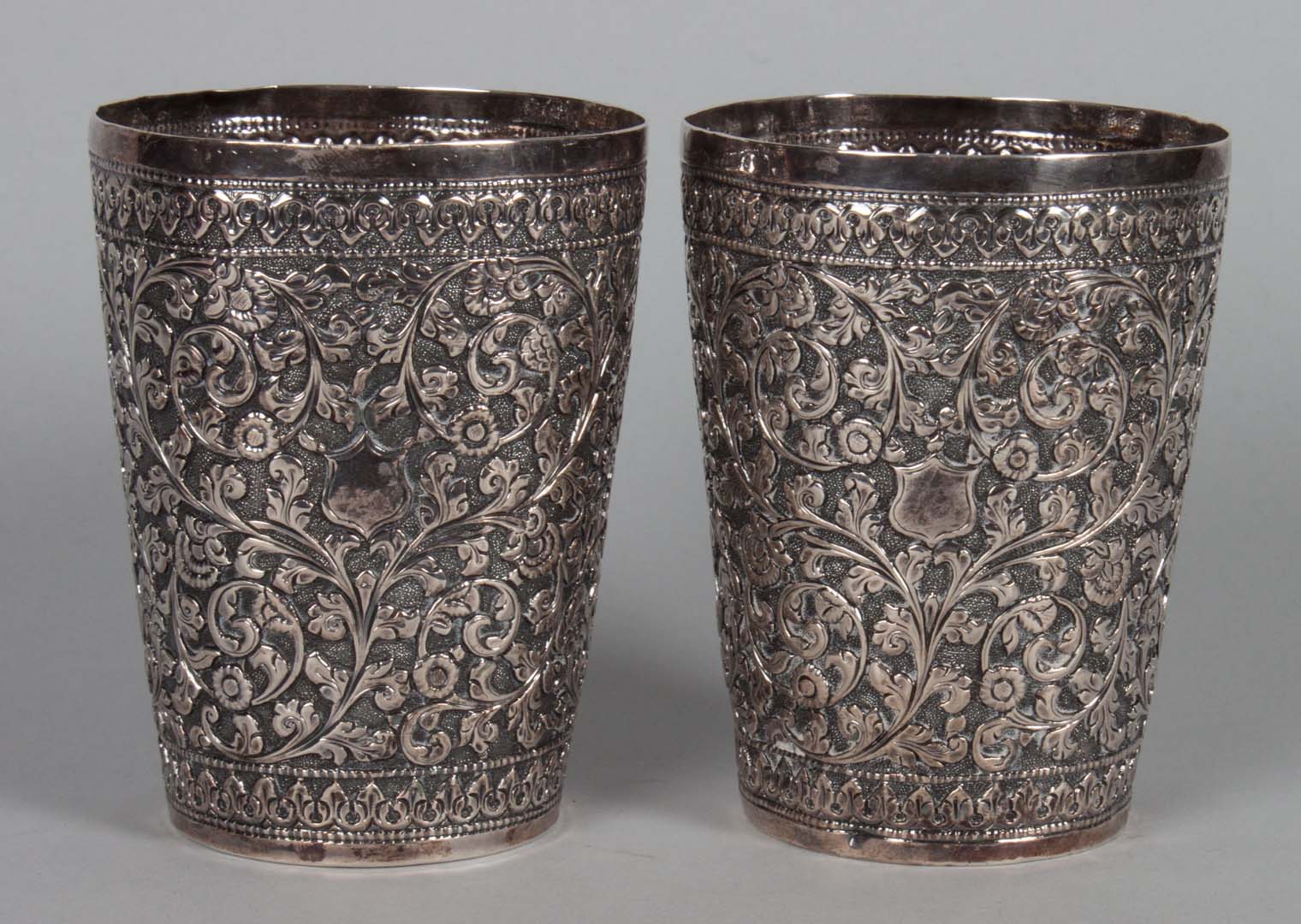 Appraisal: Pair of Thai repousse silver cups in H ozt unmarked