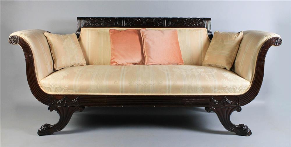 Appraisal: AMERICAN CLASSICAL MAHOGANY SETTEE WITH PEACH DAMASK UPHOLSTERY carved crest