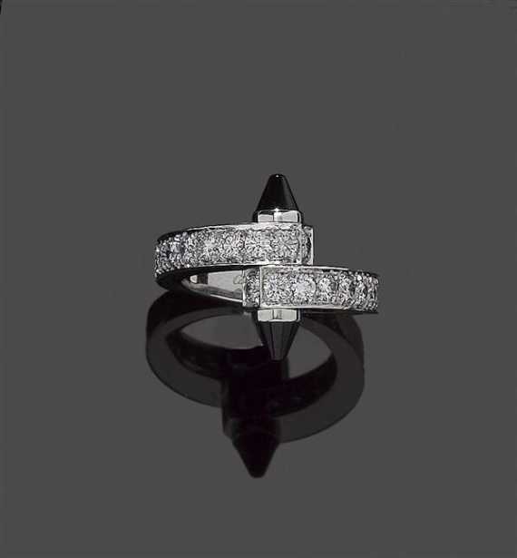 Appraisal: ONYX AND BRILLIANT-CUT DIAMOND RING CARTIER Fancy ring the top