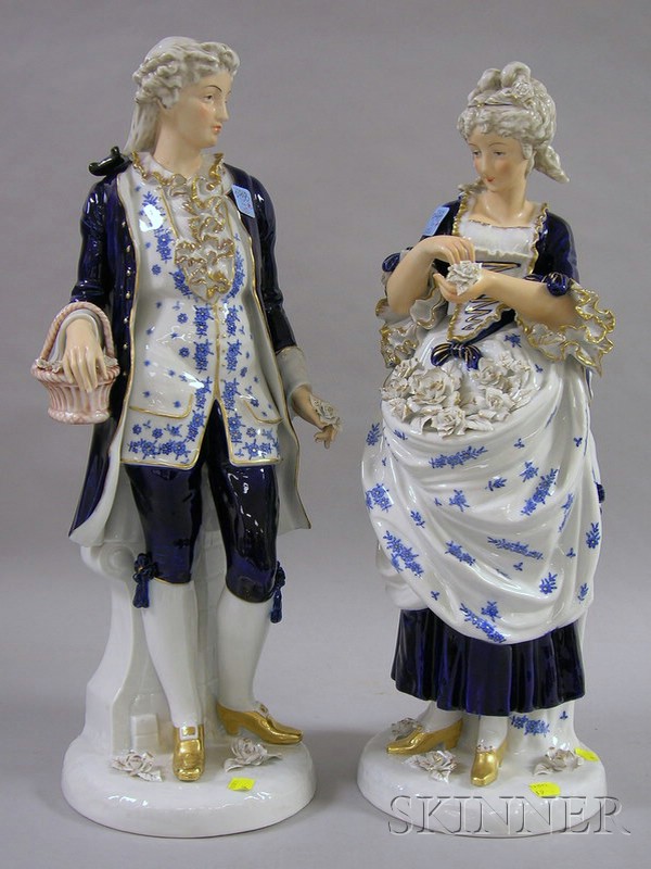 Appraisal: Pair of Large Porcelain Figures in th Century Style Dress