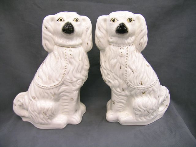 Appraisal: Pair of Old Staffordshire porcelain Spaniels tall crazing over entire