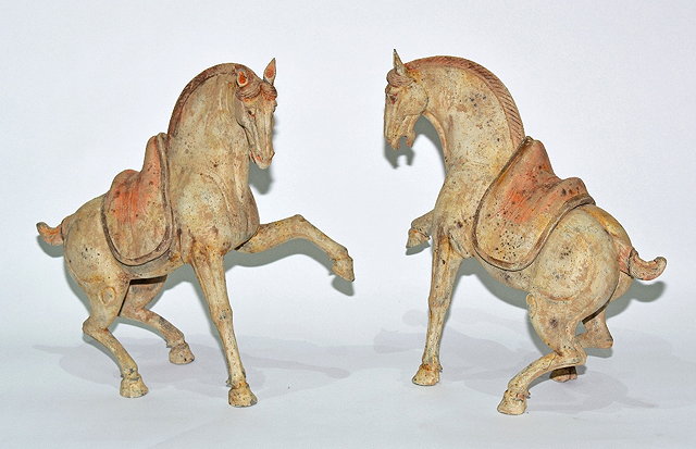 Appraisal: A pair of Chinese pottery horsesTang dynasty - each with