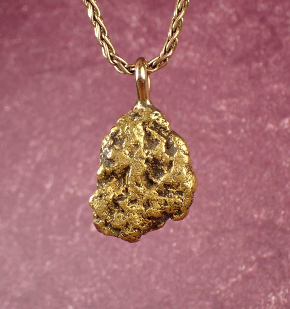 Appraisal: GOLD NUGGET PENDANT WITH FOURTEEN KARAT GOLD WHEAT CHAIN The