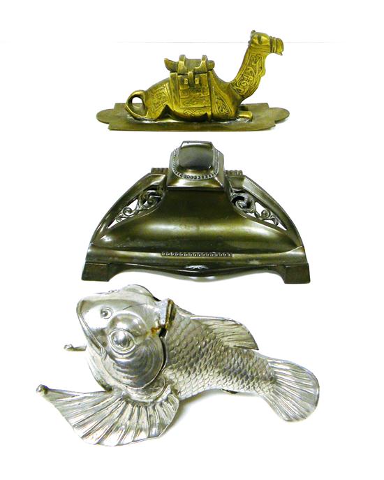 Appraisal: Three inkwells brass inkwell in form of seated camel ''