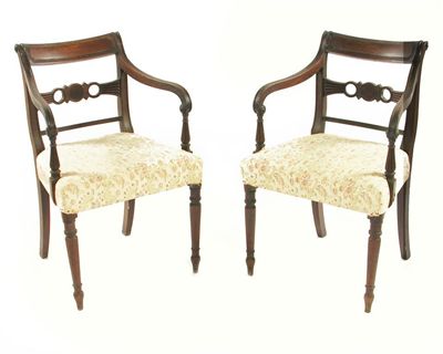 Appraisal: A pair of early th century mahogany open armchairs with