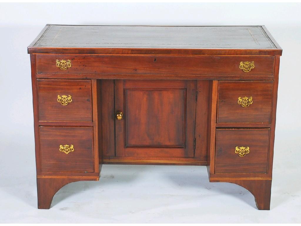 Appraisal: GEORGIAN STYLE MAHOGANY AND LINE INLAID KNEEHOLE DESK the oblong