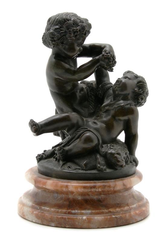 Appraisal: A Bronze Figure Depicting Satyr and Putto at Play After