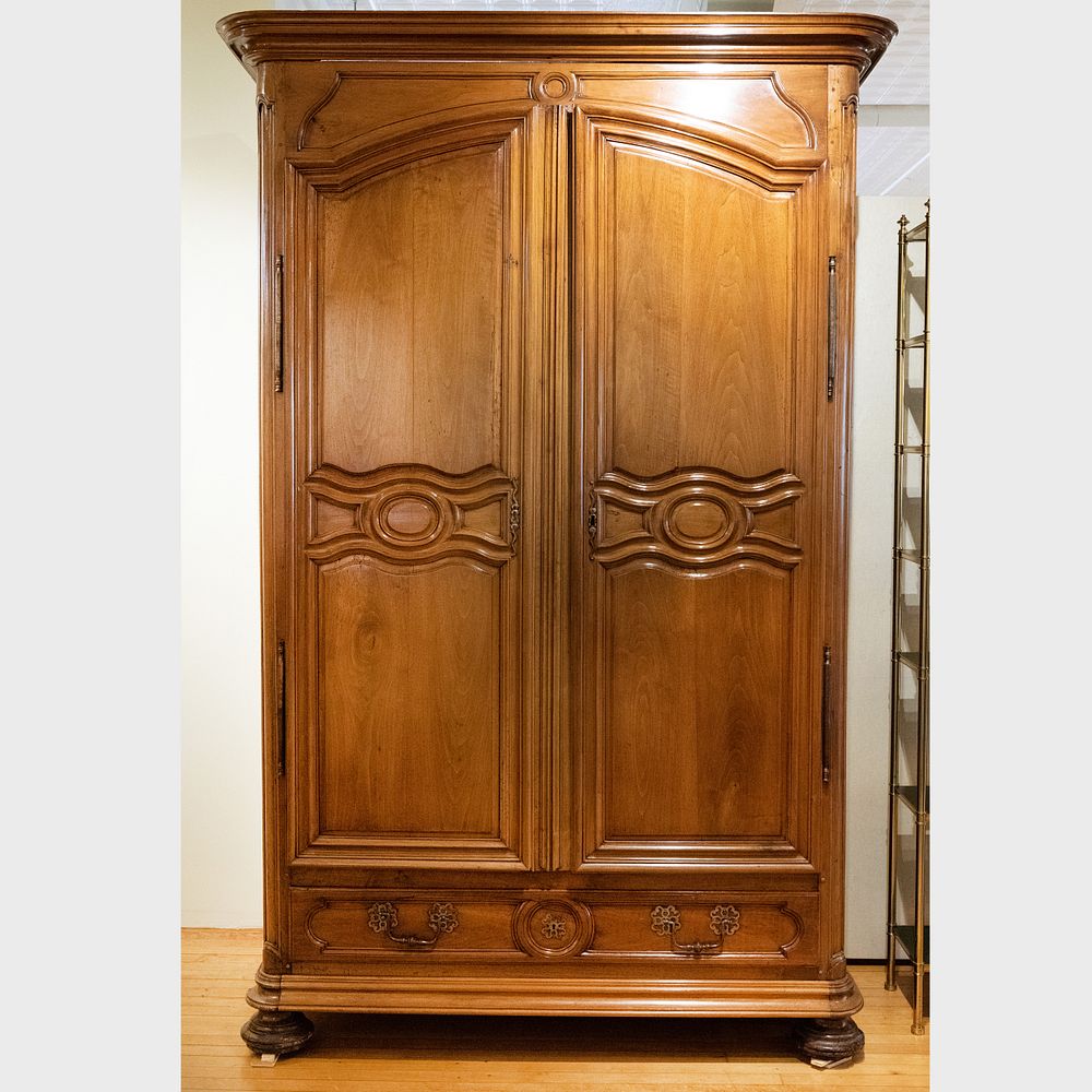 Appraisal: Large Louis XV Provincial Metal-Mounted Walnut Armoire The over hanging