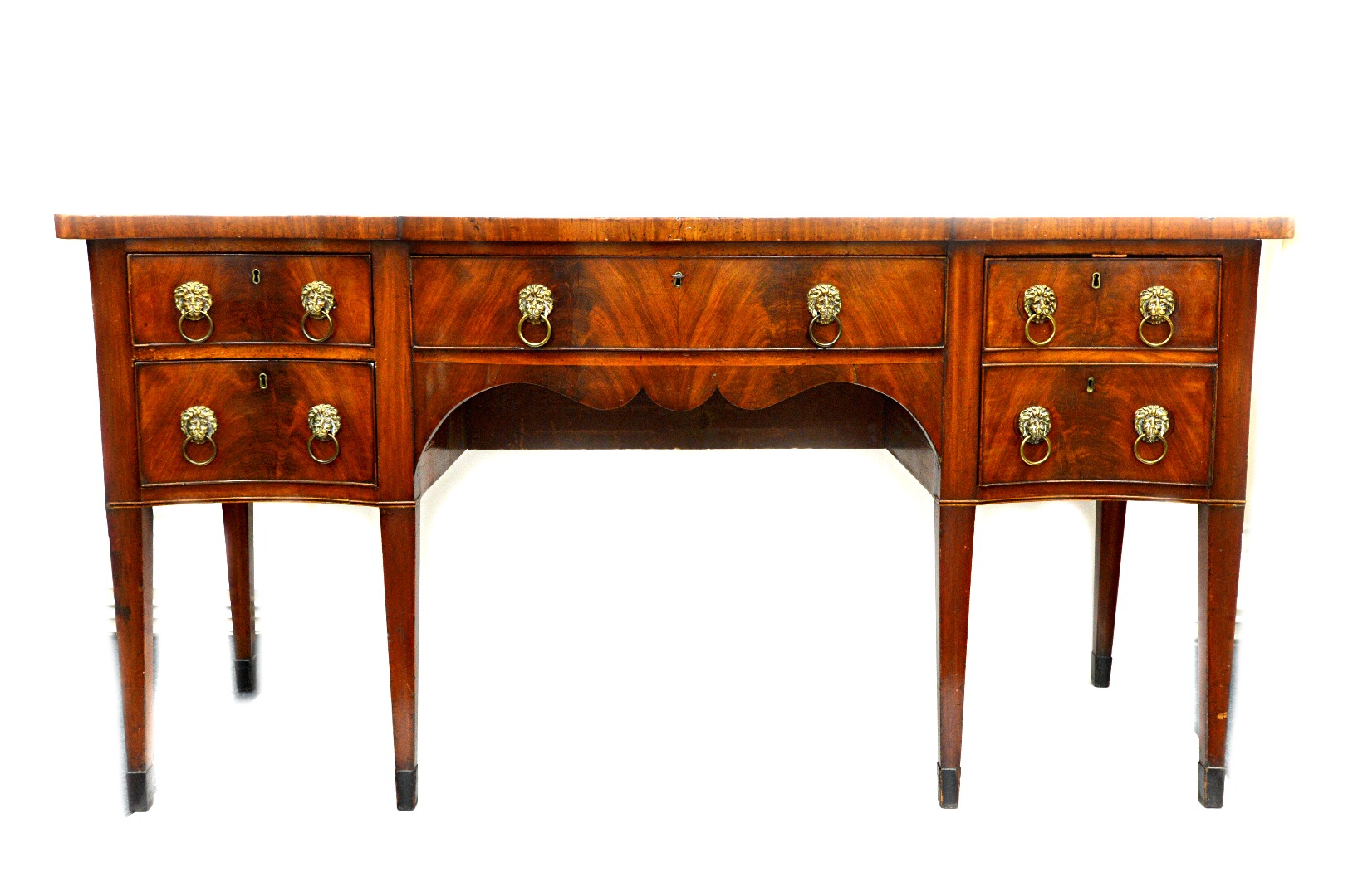 Appraisal: A George III mahogany sideboard of serpentine outline the frieze