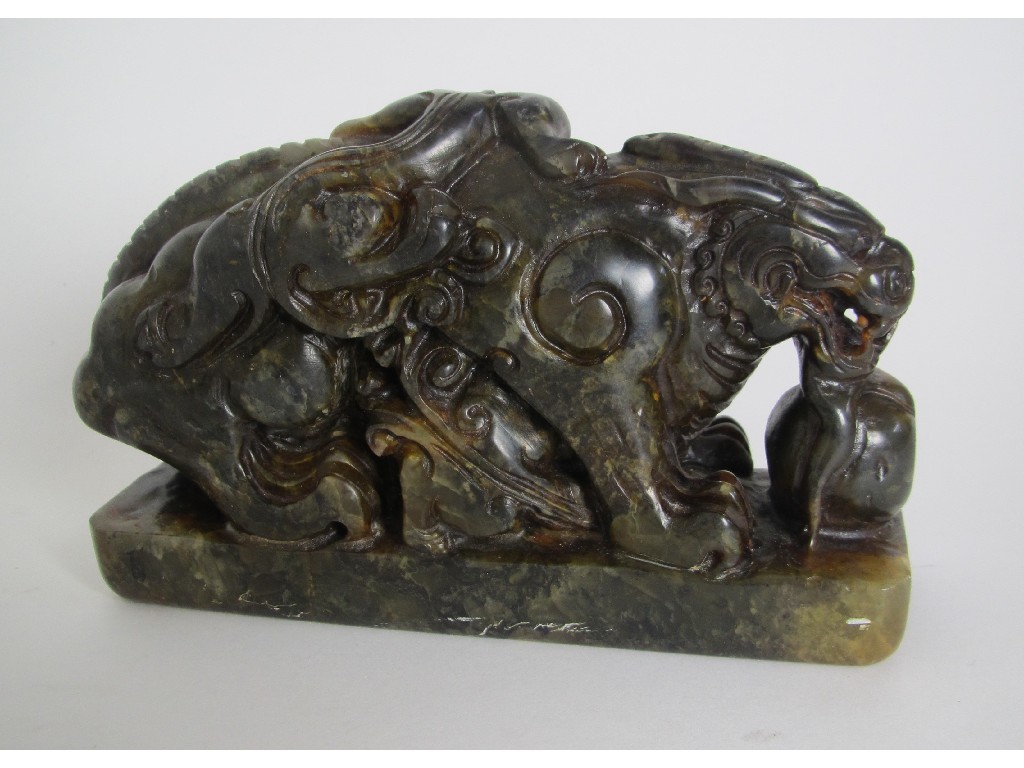 Appraisal: A Chinese hardstone seal carved with a grotesque animal quilin