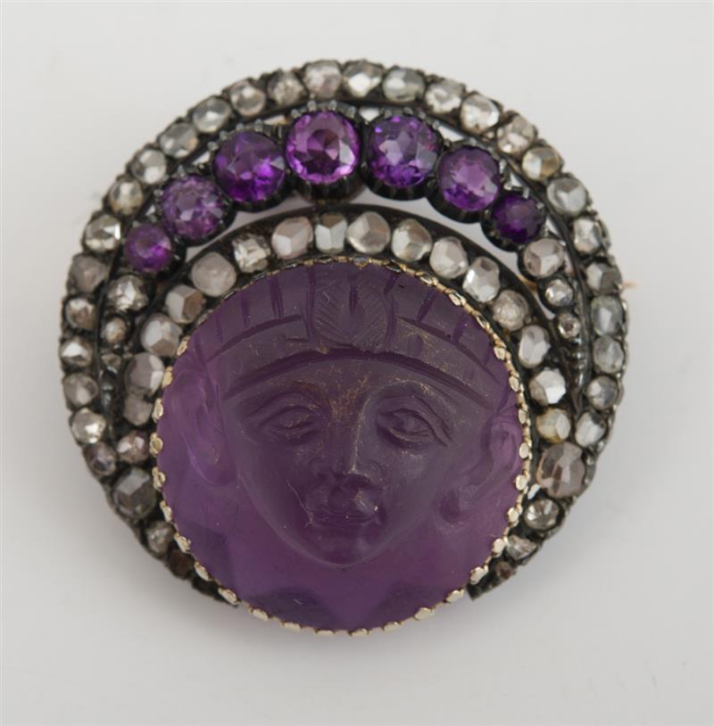 Appraisal: AMETHYST DIAMOND AND SIMULATED DIAMOND BROOCH Carved as a face