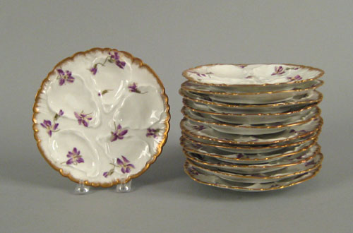 Appraisal: Twelve Limoges oyster plates with violet decoration dia