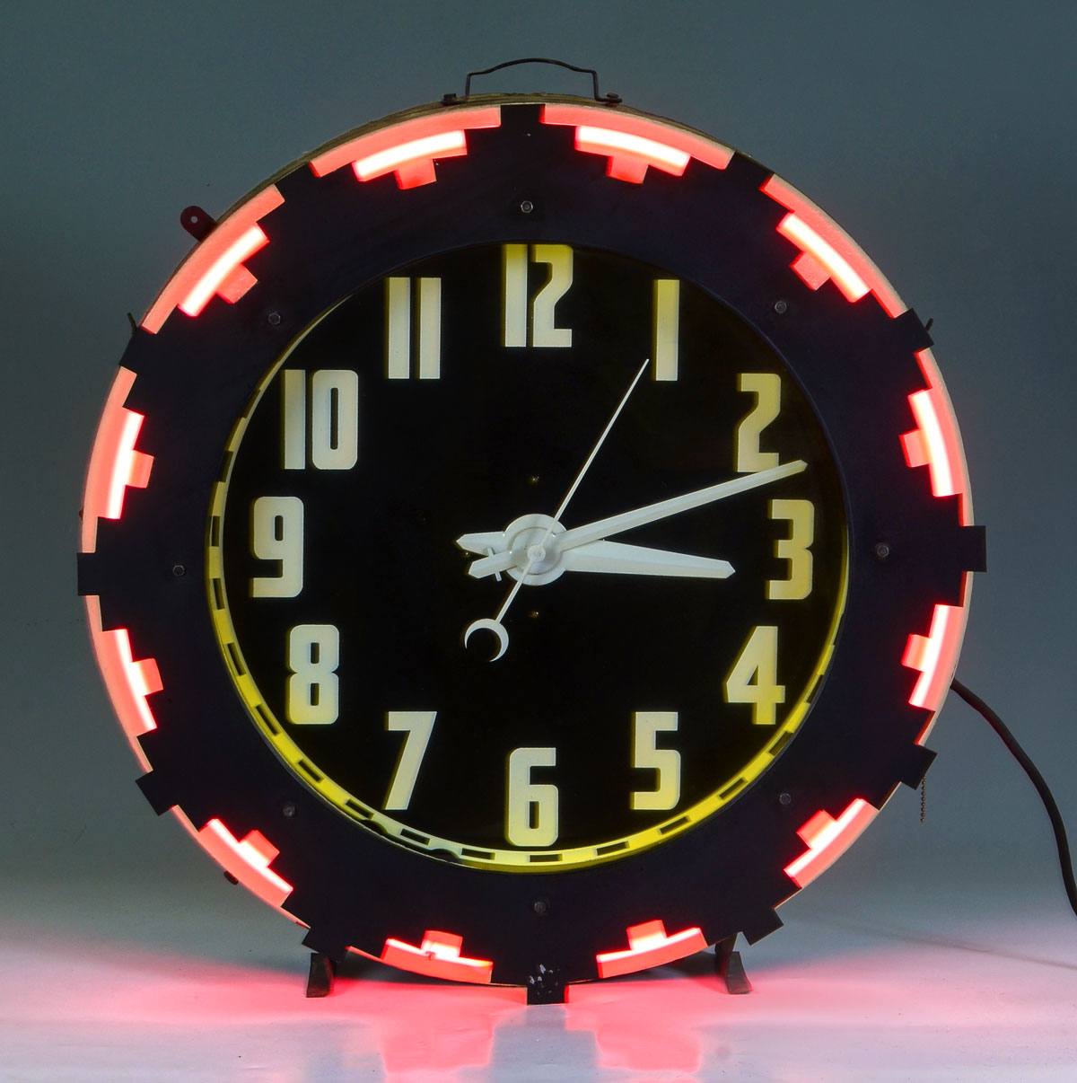 Appraisal: MID CENTURY NEON AZTEC CLOCK Circa Neon Aztec designed clock