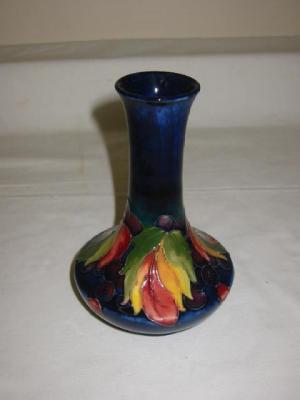 Appraisal: A WALTER MOORCROFT POTTERY VASE of bottle form tube lined