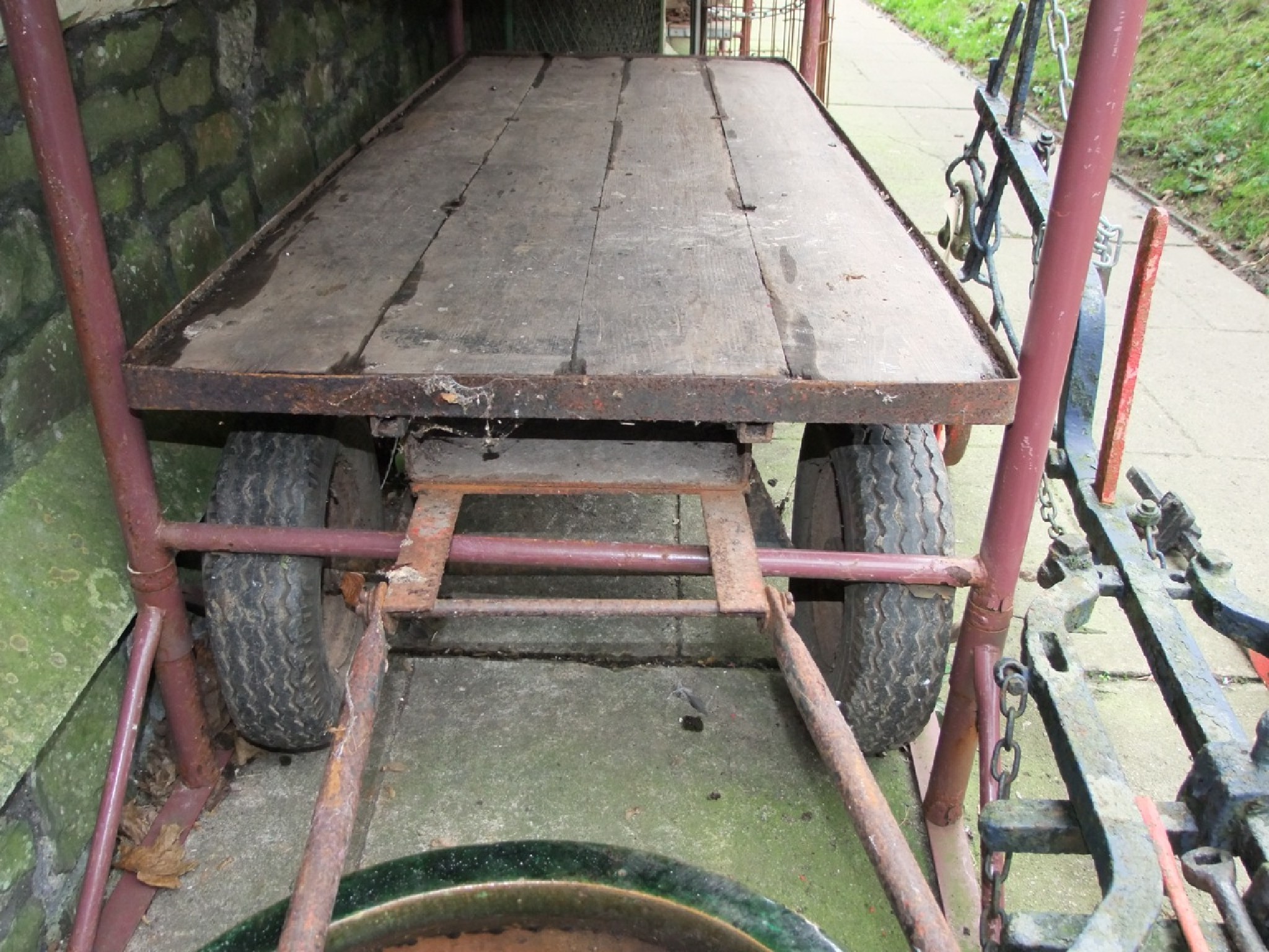 Appraisal: A steel framed platform trolley hand cart with wooden bed