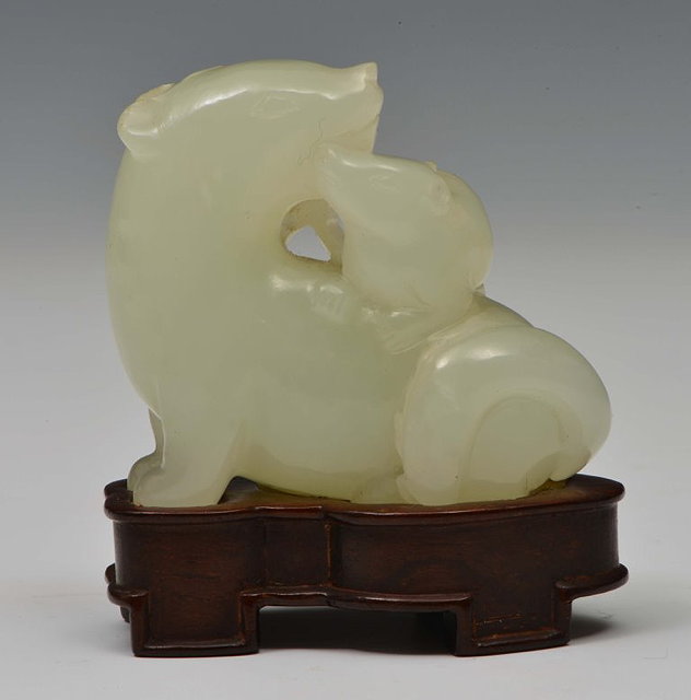 Appraisal: A CHINESE MUTTON FAT JADE ORNAMENT carved as a squatting