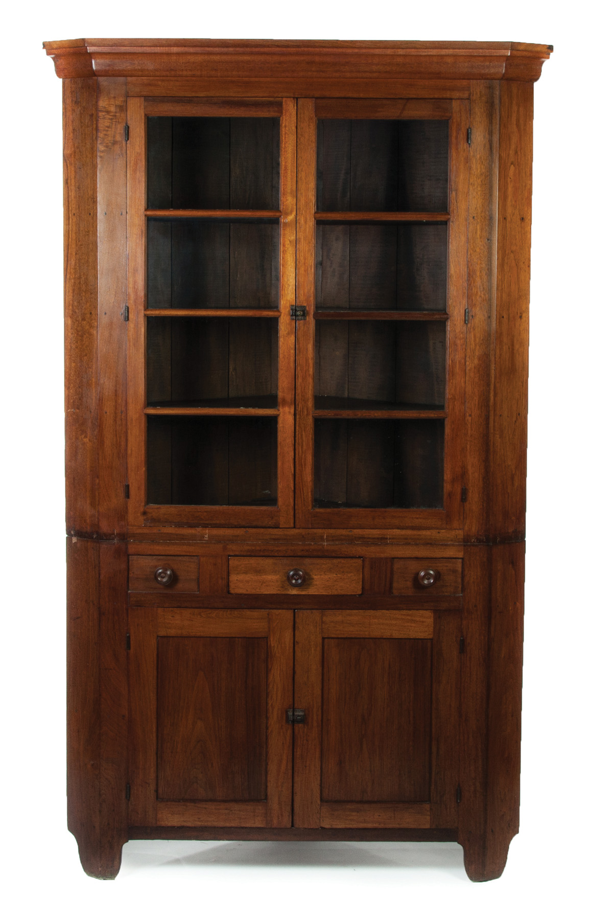 Appraisal: TWO-PIECE CORNER CUPBOARD American mid th century walnut with pine