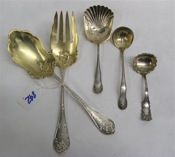 Appraisal: FIVE AMERICAN STERLING SILVER SERVING PIECES all gold wash accents