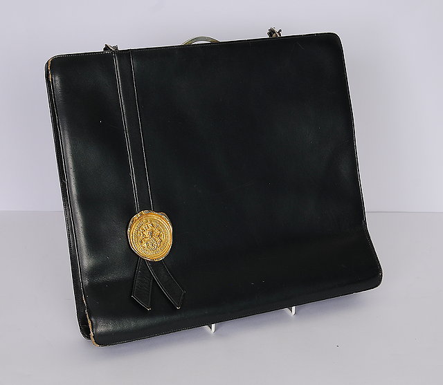 Appraisal: A navy blue leather bag briefcase with a gilt metal