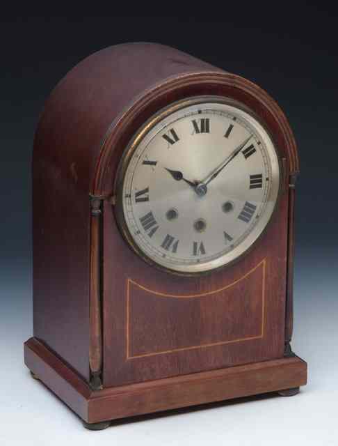 Appraisal: AN EDWARDIAN MAHOGANY MANTEL CLOCK having a silvered Roman dial