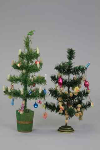 Appraisal: TWO FEATHER TREES WITH ORIGINAL CANDY DECORATION Dark green feather