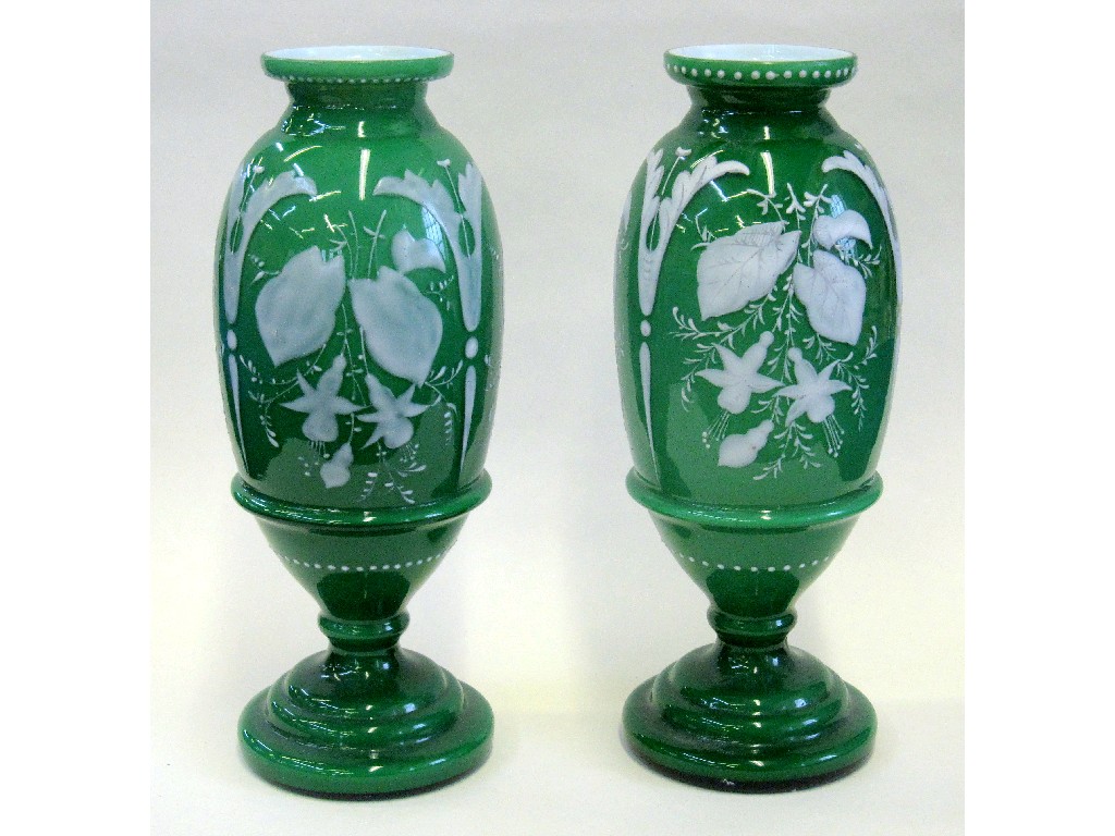 Appraisal: Pair of Victorian green and white glass vases with floral