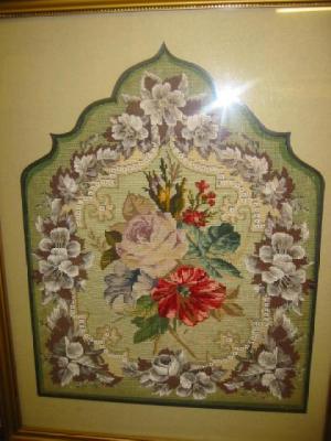 Appraisal: A VICTORIAN BEADWORK PANEL the woolwork centre depicting roses within