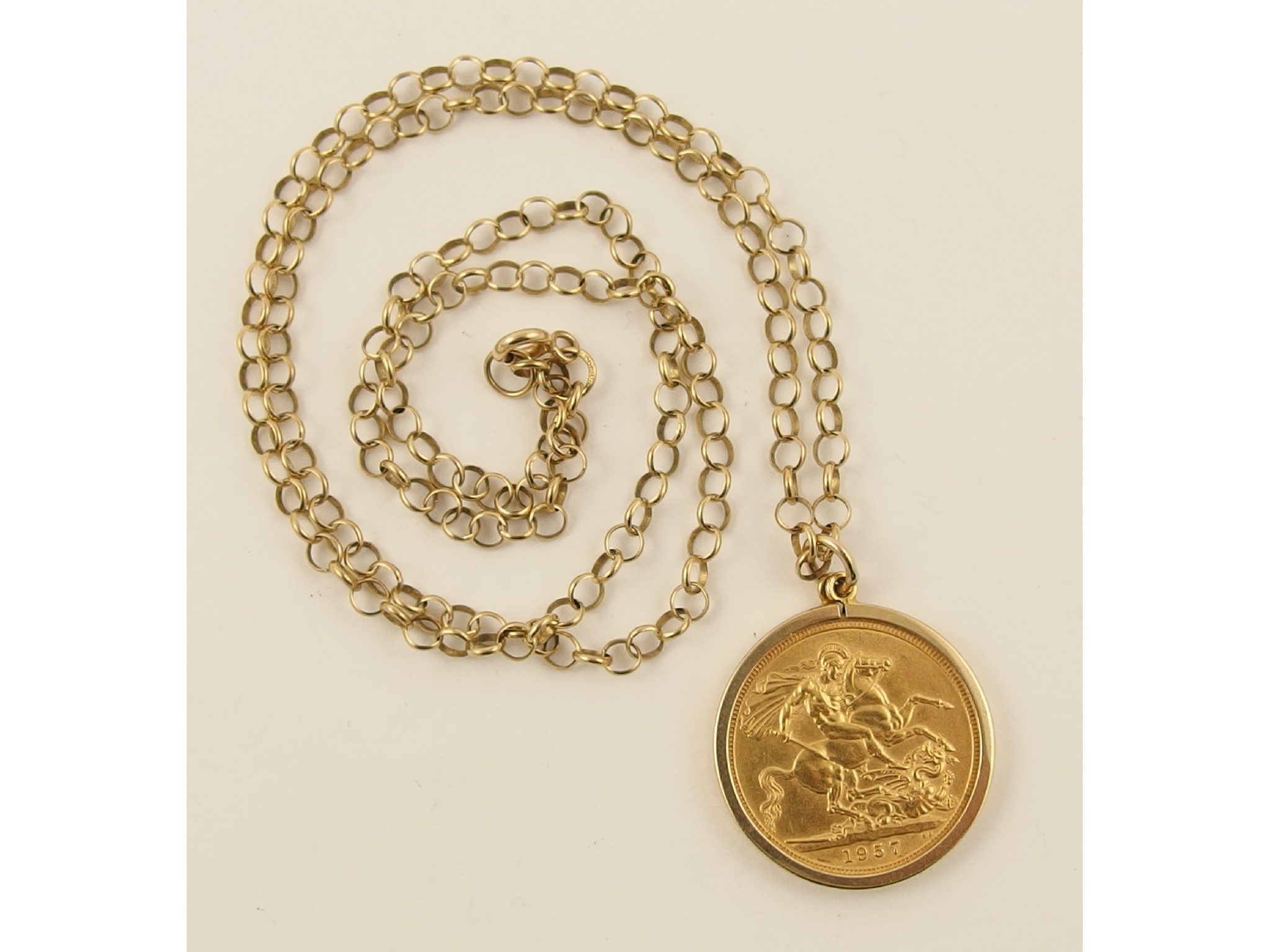 Appraisal: A gold sovereign in a ct mount with ct chain