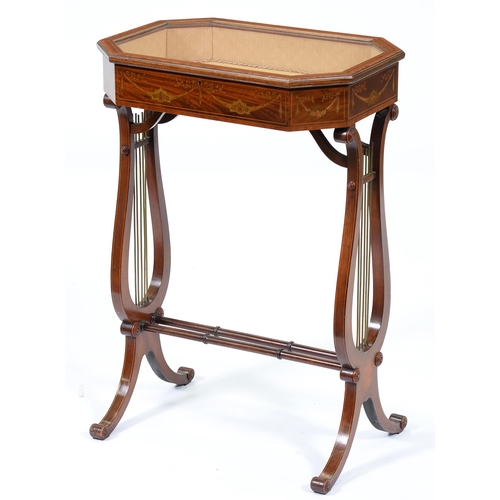 Appraisal: An Edwardian mahogany display table crossbanded in satinwood and inlaid